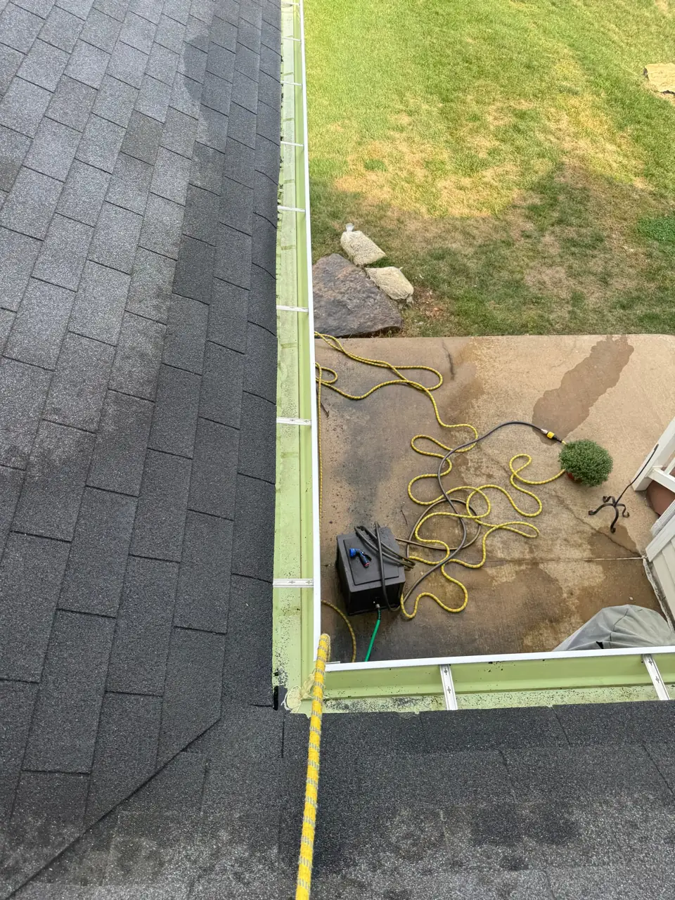 Cleaned gutters meeting at an inside corner where two roof lines join, Chesterfield, MO